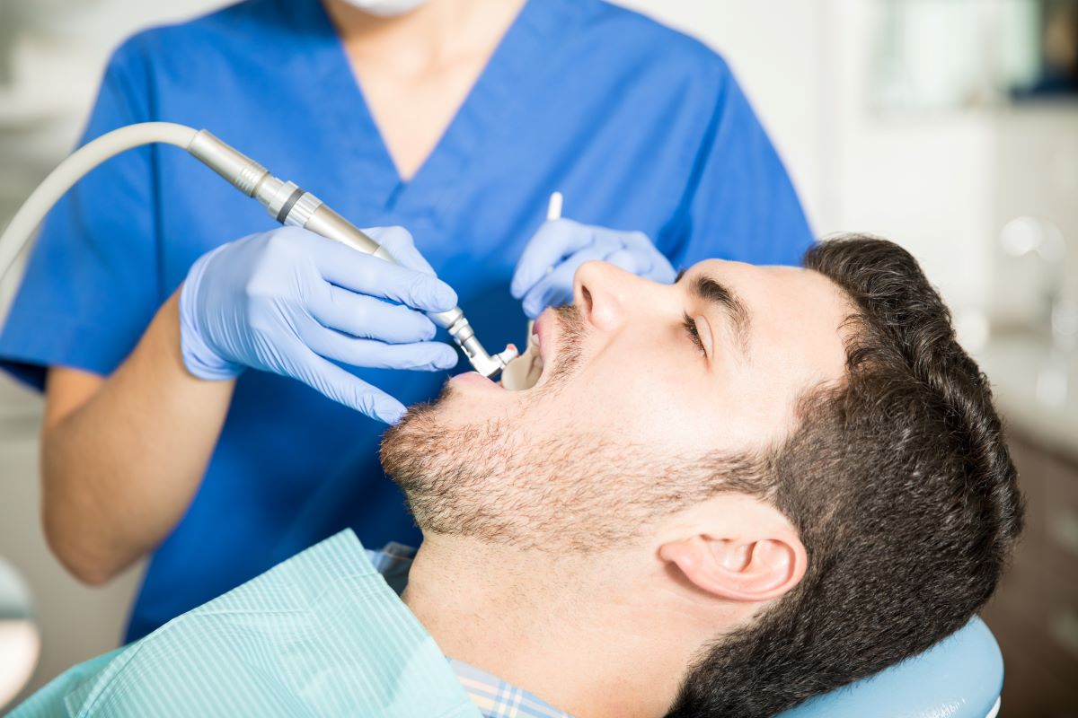 Teeth Cleaning Polishing Step — Oakville Dental Dental hygienist polishing a patient's teeth during a routine teeth cleaning at Oakville Dental